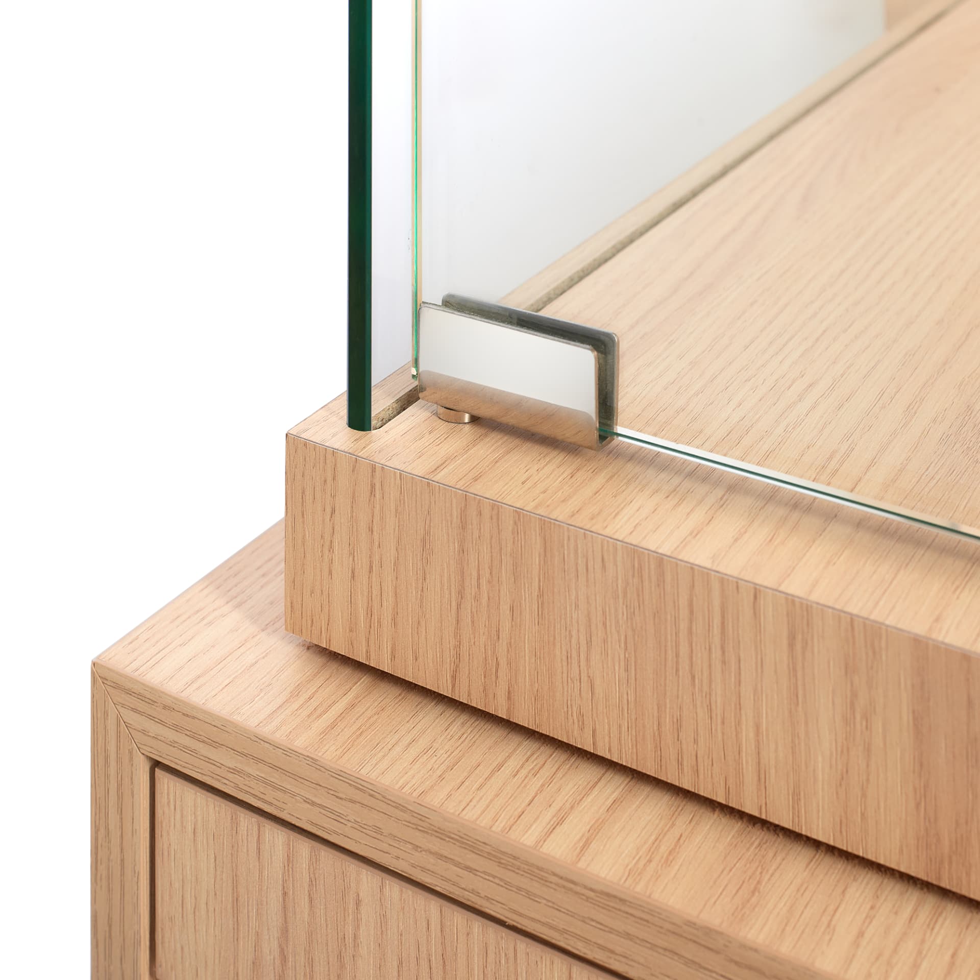 Detail of a stainless steel glass clamp on an oak counter top