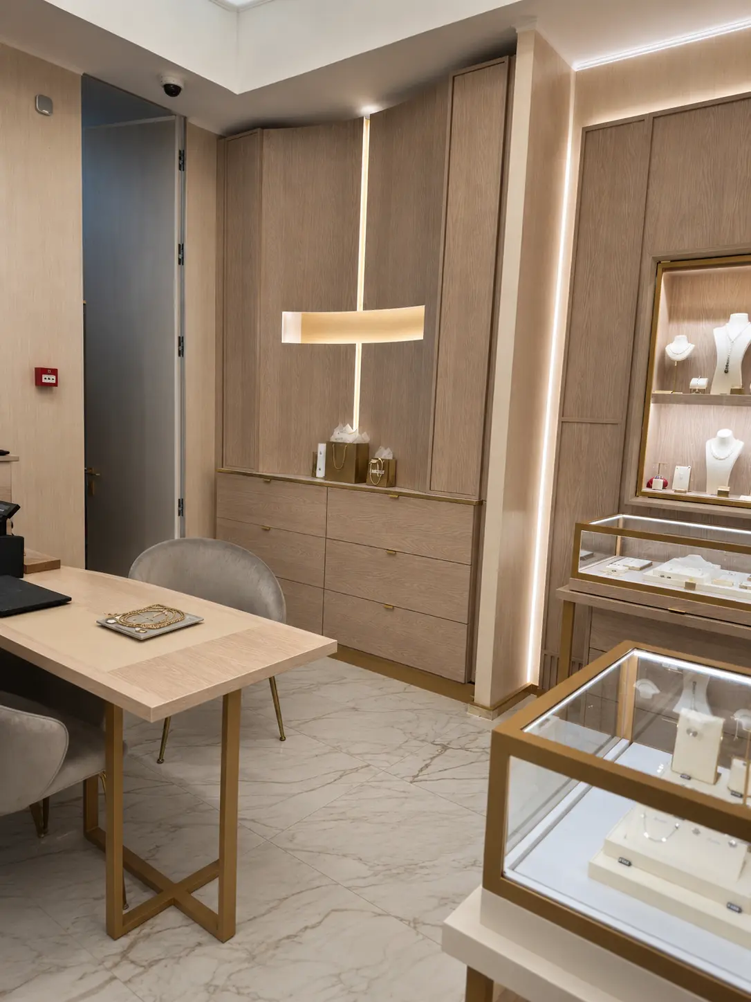 Oak back office desk with lit wall vitrine and glass showcase