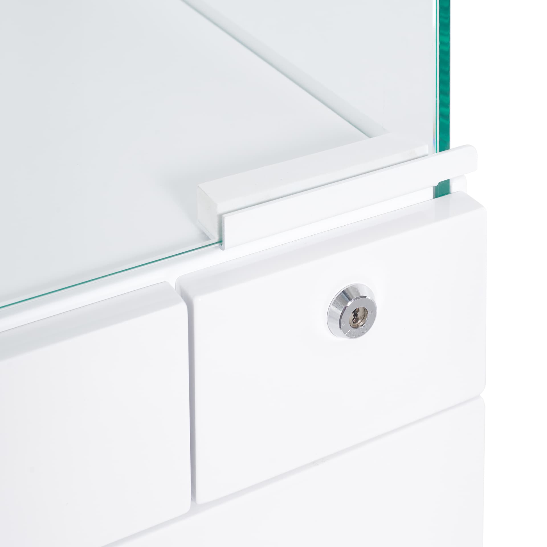 Detail of a lockable white drawer front with glass top